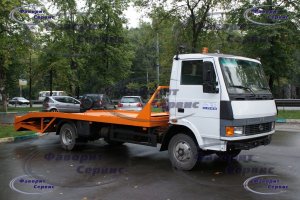 Эвакуатор TATA-613 АМУР-4346 с ломаной платформой